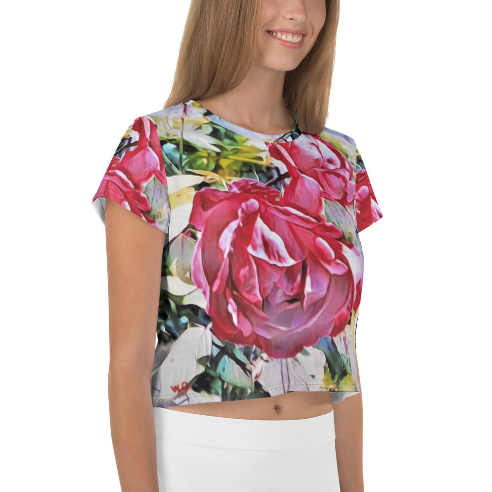 a woman holding a pink rose in a vase