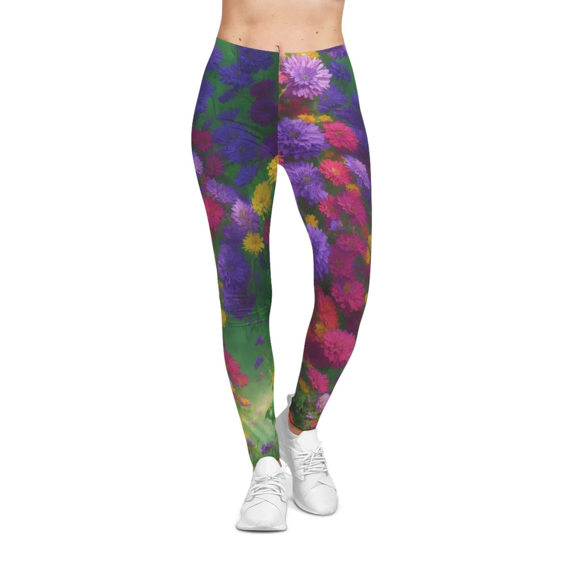 Bold Blooms women’s casual leggings with a striking all-over floral print in vivid purple, pink, yellow, and green. Artistic, flexible, and perfect for yoga, fitness, or creative fashion wear.