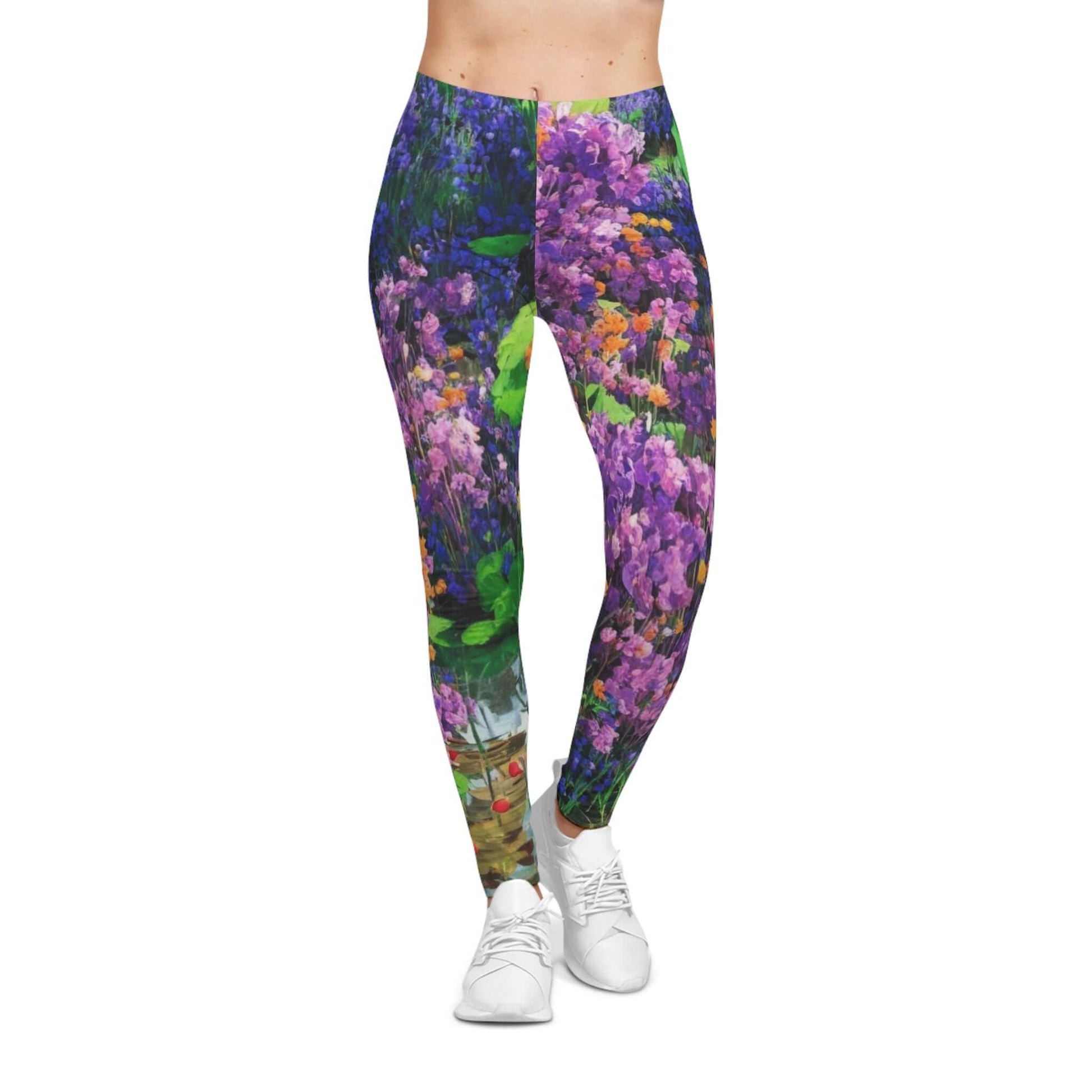 Floral Bloom women’s casual leggings featuring an original all-over floral artwork with purple, green, and orange hues. Artistic, comfortable, and perfect for yoga, casual wear, or bold fashion statements.