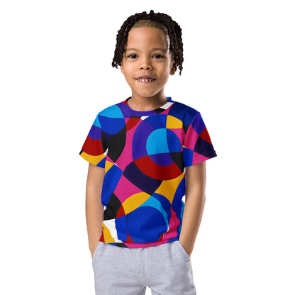 Child wearing a colorful Kids T-Shirt with The Geometry of Sound abstract geometric pattern featuring circles in blue, red, yellow, and pink. Artistic retro design inspired by modernist color harmony.