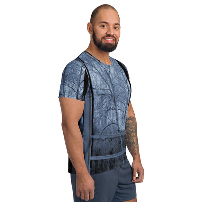 Men’s athletic t-shirt featuring the Window design with a frosted winter scene viewed through a window, showing a snow-touched tree and poetic cold-season atmosphere.