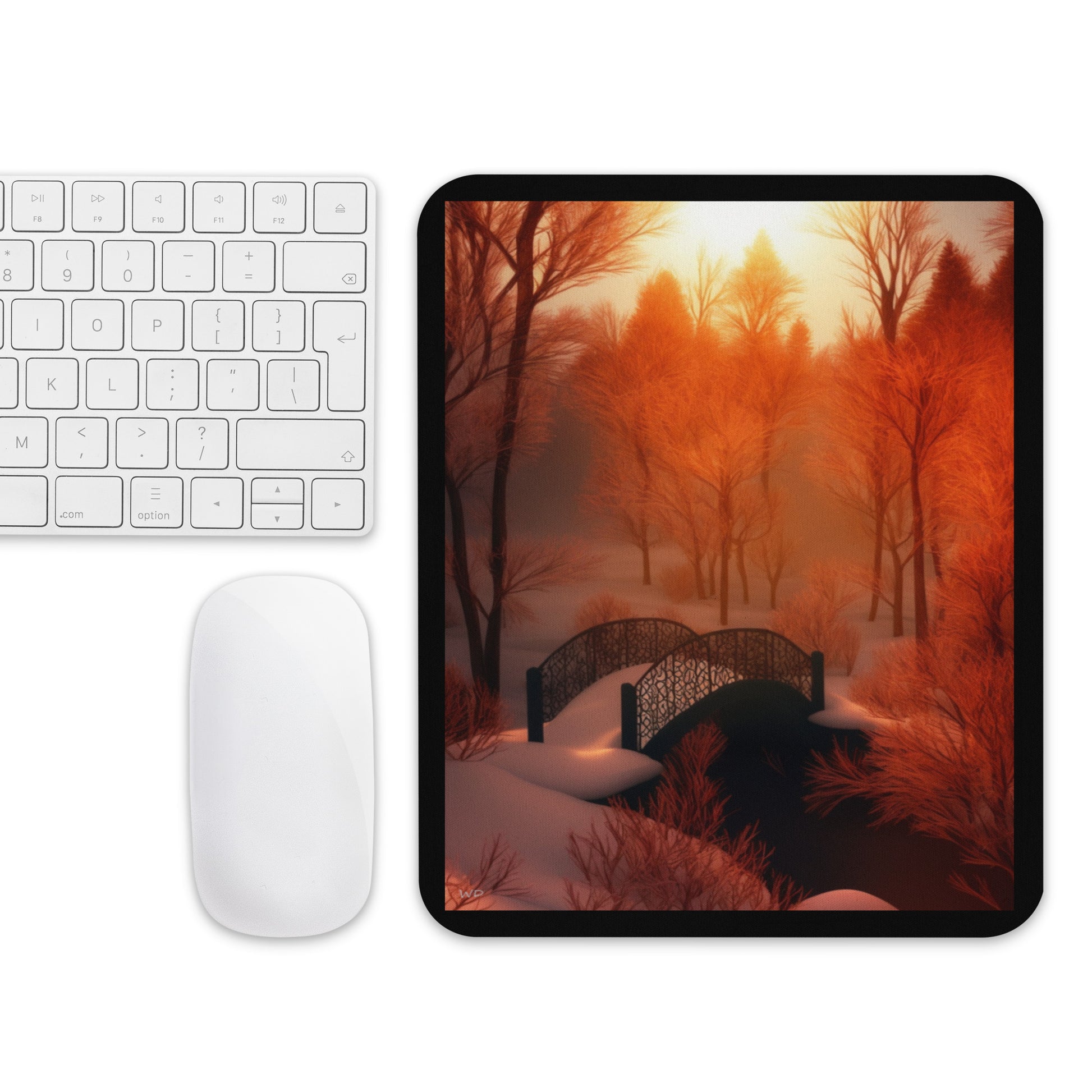 Mouse pad featuring a fantasy landscape titled “Bridge of Silent Dawn,” showing a snow-covered bridge surrounded by glowing amber trees under a gentle sunrise — a serene and inspiring desk accent.
