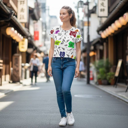 Young woman walking in a traditional urban street wearing a retro typography colorful letters all over print crop tee modern graphic streetwear outfit casual summer style creative fashion mood youthful movement natural light city background dynamic lifestyle scene