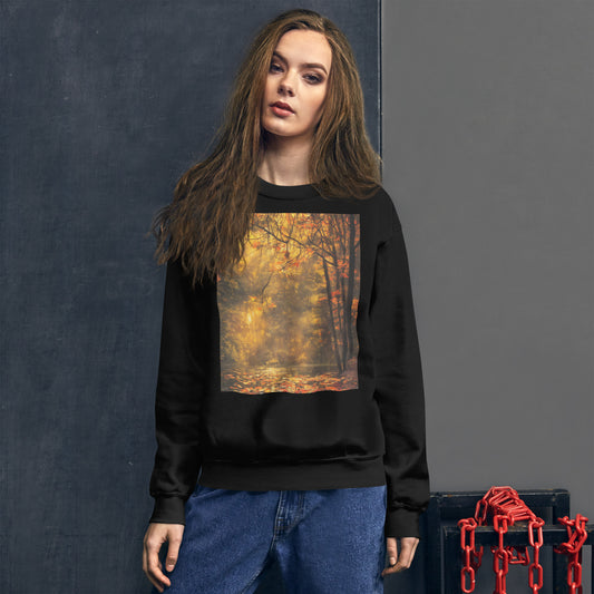 Unisex sweatshirt featuring the artwork "A Pond in Autumn" – a golden forest scene with sunlight, trees, and red autumn leaves floating on a pond. Cozy fall fashion available in four colors.