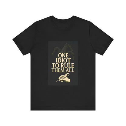 Unisex T-shirt with the humorous quote “One Idiot to Rule Them All,” a witty parody for geeks and writers. French artistic design printed by Canadian or American companies with worldwide branches.