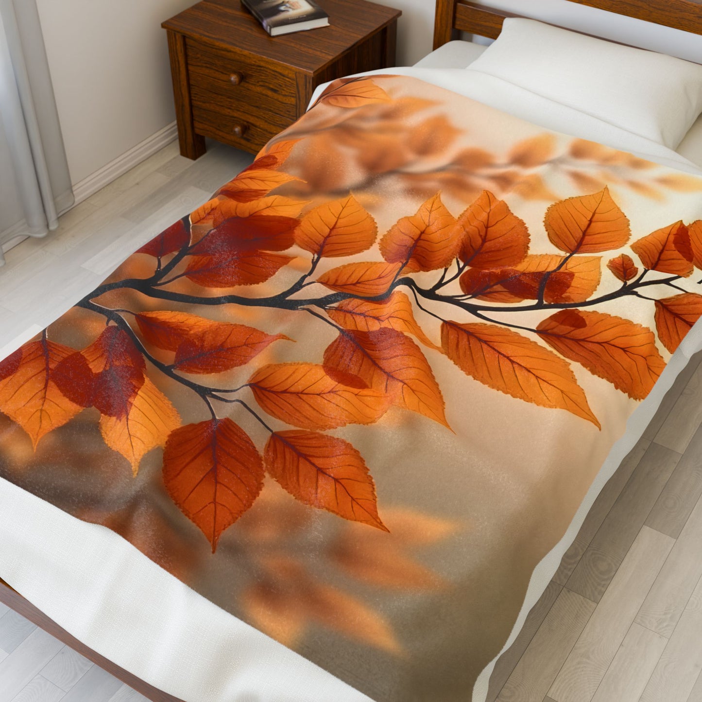 Velveteen Plush Blanket on bed featuring glowing autumn leaves in warm golden orange tones, soft cozy fabric, nature-inspired fall design, elegant seasonal home decor throw for bedroom or living space, inviting warm atmosphere for comfort and relaxation.