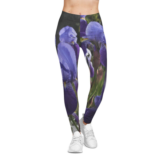 Women’s Casual Leggings (AOP) featuring an elegant iris floral design in vivid purple, blending artistic fashion with nature-inspired style. Perfect for yoga, streetwear, or everyday wear.