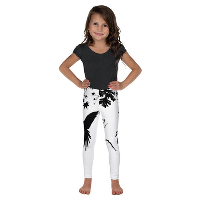 Kids leggings “Freedom” with a black bird silhouette landing on a branch — artistic minimalist design in black and white.