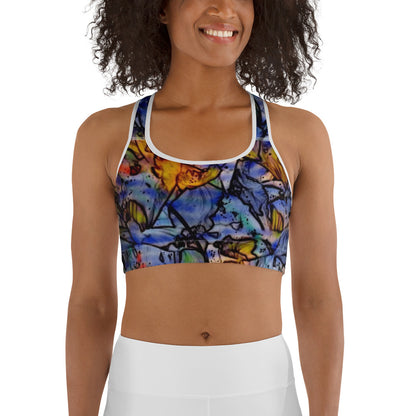 Woman wearing a floral impressionist sports bra with blue, orange, and yellow artistic flower design. Unique activewear design by allmyart.net for gym, yoga, or casual outfits.