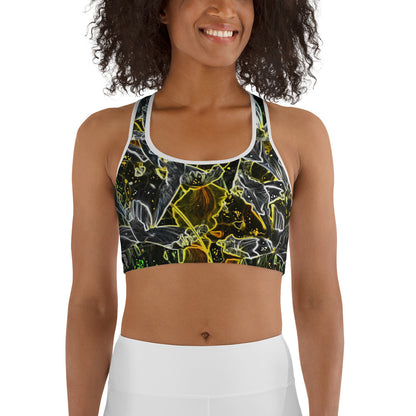 Woman smiling and wearing a dark floral sports bra with glowing neon outlines in yellow, green, and white. Modern active-wear design with bold contrast, ideal for fitness and everyday comfort.