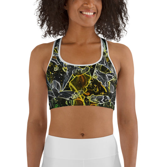 Woman smiling and wearing a dark floral sports bra with glowing neon outlines in yellow, green, and white. Modern active-wear design with bold contrast, ideal for fitness and everyday comfort.