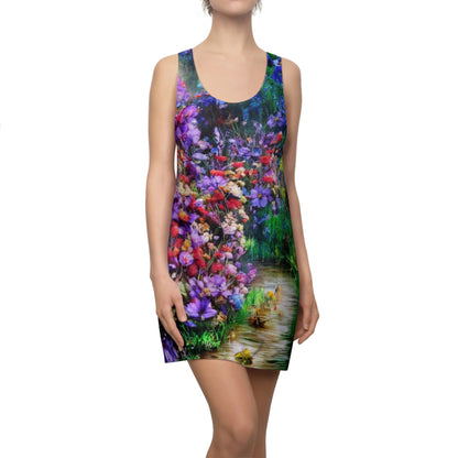 Woman wearing a racerback dress with a vivid fine art garden design featuring blue pink red and violet flowers surrounding a soft hidden path creating a serene nature inspired scene with lush colors and artistic detail