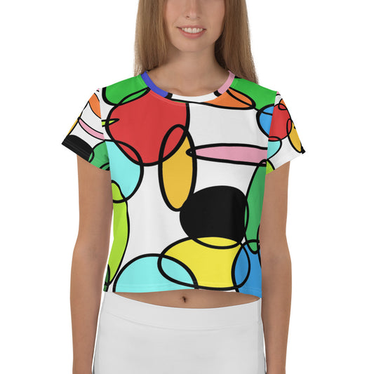 All-Over Print Crop Tee featuring an abstract chain design of colorful linked circles inspired by retro 60s and 70s geometric art. Bright tones of red, yellow, turquoise, and green create a joyful visual rhythm, ideal for artistic streetwear or creative summer fashion.