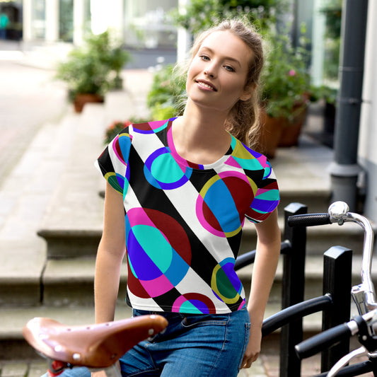 All-Over Print Crop Tee featuring overlapping colorful geometric circles in 60s – 70s pop style. French Design merging vintage energy and modern abstract expression, ideal for home, office, or creative studio looks.